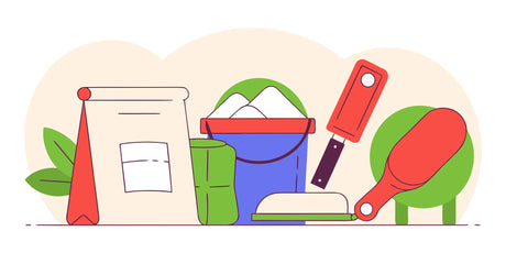 Essential concrete tools and supplies like a trowel and float ready for a project.